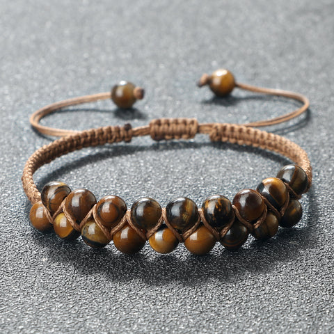 Stack of various bracelets including the Tiger Eye Beaded Bracelet for a layered look