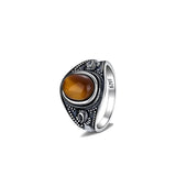 Elegant Silver Signet Ring Featuring a Polished Tiger Eye Stone
