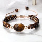 Lifestyle image of the Tiger Eye Bracelet worn at a coffee shop