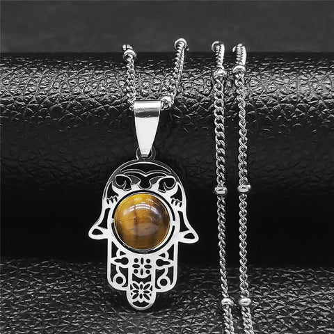 Lifestyle image of a young woman styling the Tiger Eye Stone Necklace with casual attire