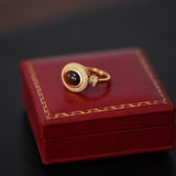 Close-up of the resizable Regal Tiger Eye Masterpiece Ring for women set in 18k gold
