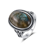 Side view of Trinity Clover Signature Ring showing the silver band and Tiger Eye stone