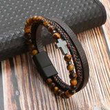 Close-up of Tiger Eye Bracelet with Cross Charm and Vintage Leather Wrapping